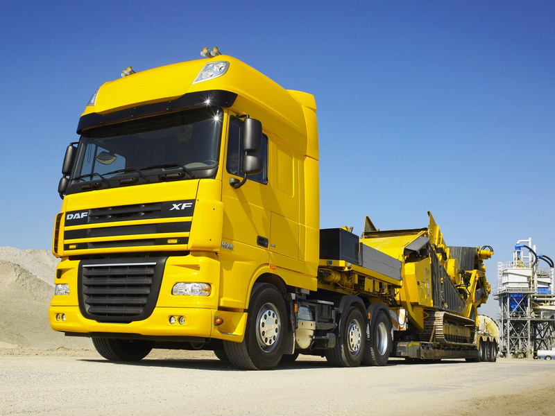 large, delivering, The trailer, construction vehicle, cargo Container, sky, outdoors, mode of transportation, land Vehicle, no People, Truck, freight Transportation
