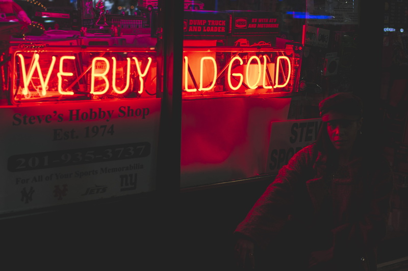 information, real people, non-western script, advertisement, woman, text, commercial sign, neon sign, person, signage, built structure, nightlife, light