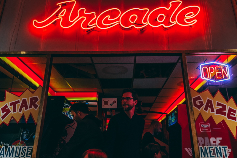neon, group of people, game, red, leisure activity, restaurant, communication, adult, gameboy, food and drink, commercial sign, illuminated, text, sign
