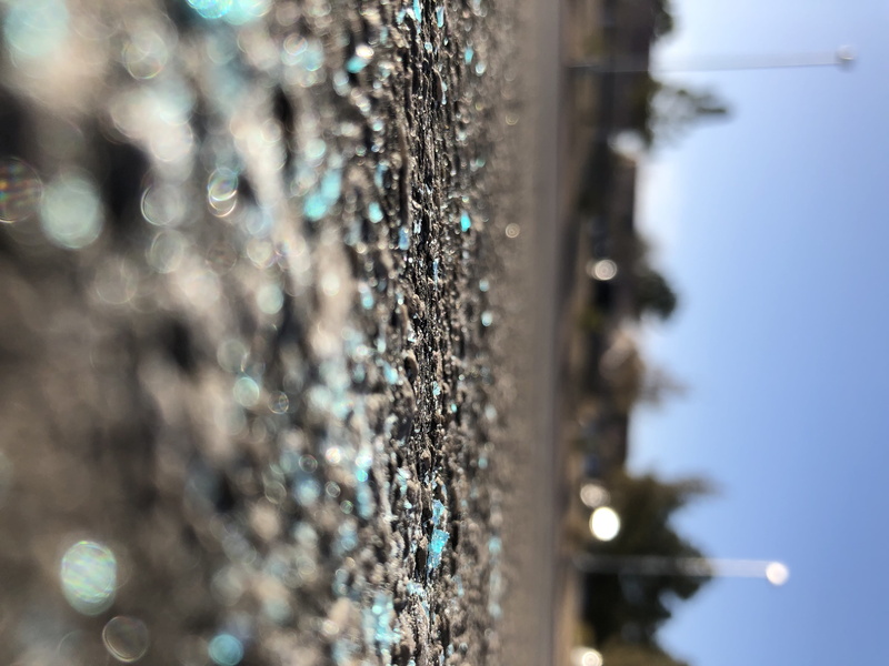nickel, word, hand, asphalt, selective focus, nature, sunlight, road, sphere, ground, focus on foreground, dirt road, shiny, built structure, blue, 4K