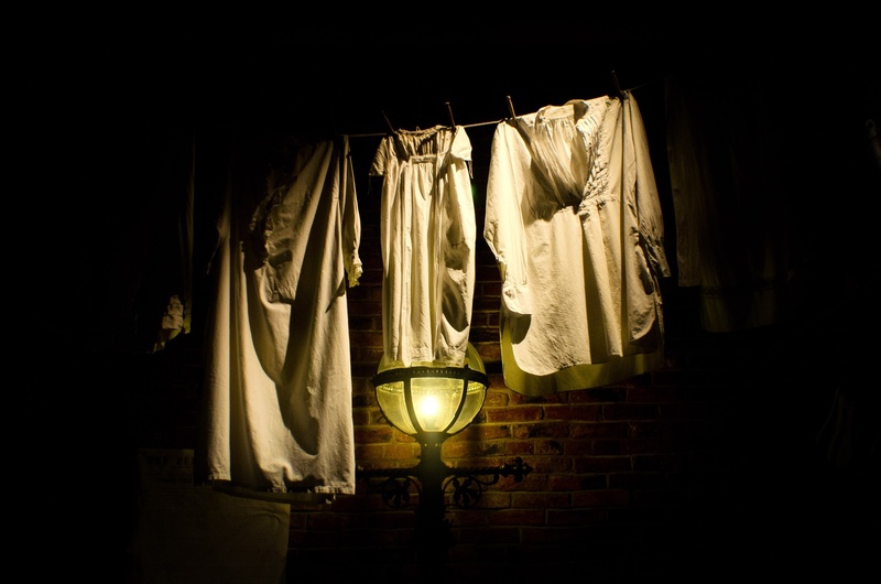odor, glowing, lighting equipment, hanging, no people, indoors, dark, domestic room, night, home interior, clothesline, money, architecture, work, electricity