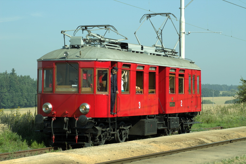 train - vehicle, railcar, land vehicle, no people, outdoors, railway nostalgia, track, cable, nostalgia, connection, old, transportation, power supply