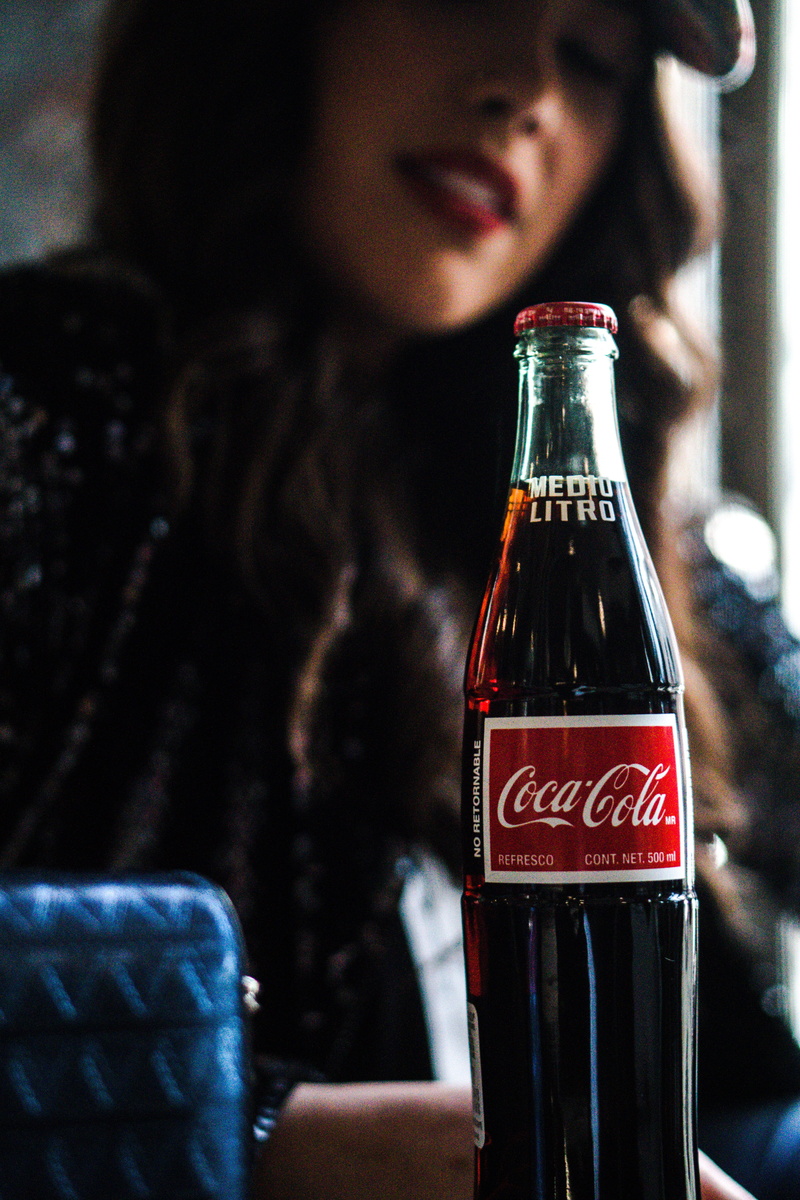 food and drink, 5K, young adult, refreshment, person, western script, alcohol, soda, indoors, communication, real people, beverage, machine, goblet, coca