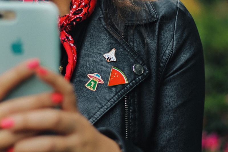 jacket, button, detail, black, hand, red, lady, woman, smartphone, teal, government, space, case, human hand, indoors, phone, wireless technology, communication