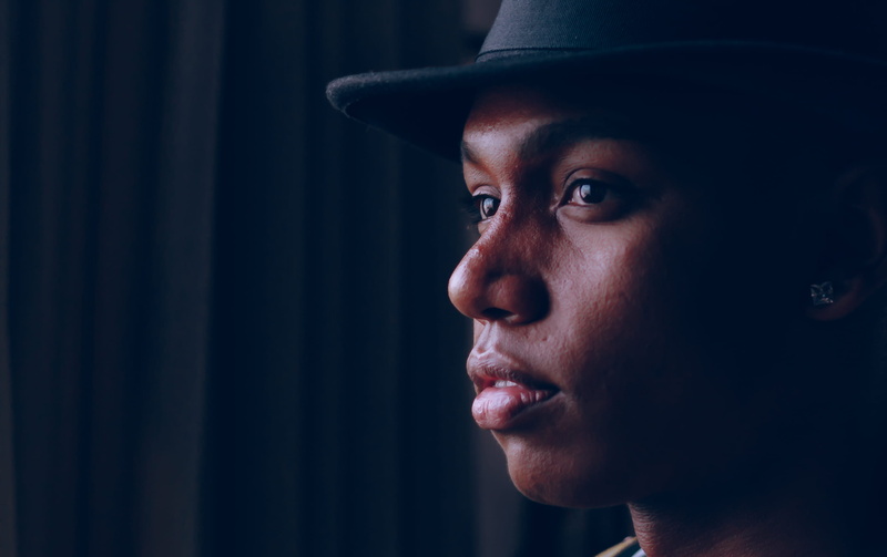 contemplation, headshot, handsome, stare, hat, young adult, focus on foreground, profile view, pensive, dark, pose, african, one person, clothing, adult