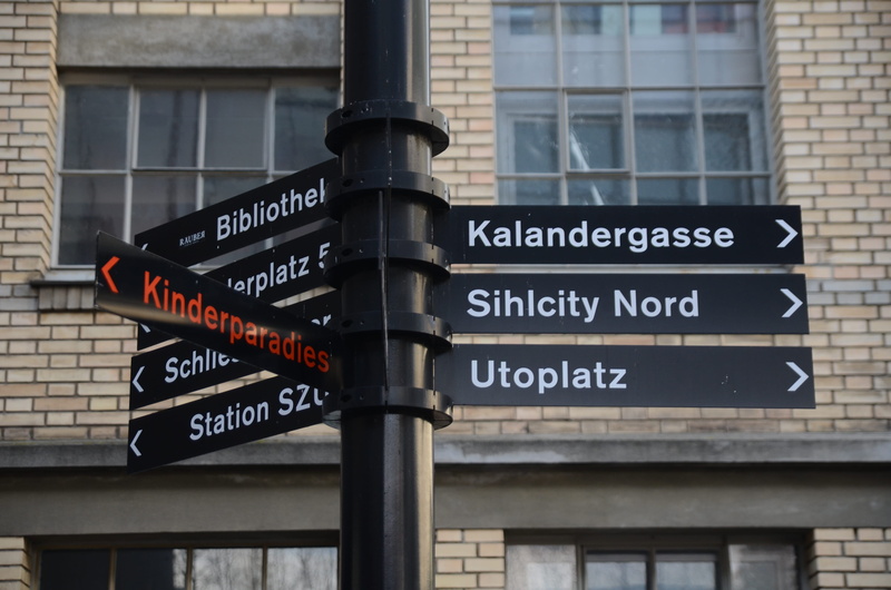 western script, zürich, architecture, day, arrow symbol, building exterior, text, city, road sign, information, communication, 4K, no people, sihlcity