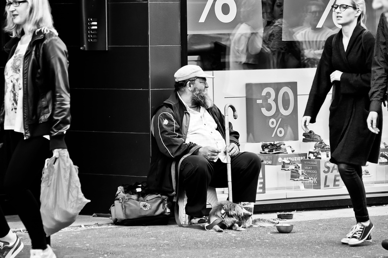 penner, full length, city, facial hair, grayscale, casual clothing, looking, clothing, human, clochard, streetscape, man, standing, business, everyday scene