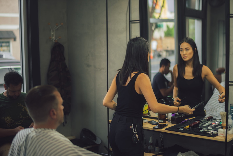 real people, haircut, street photography, woman, lifestyles, style, friendship, standing, indoors, sitting, person, commercial, streetwear, barber, occupation