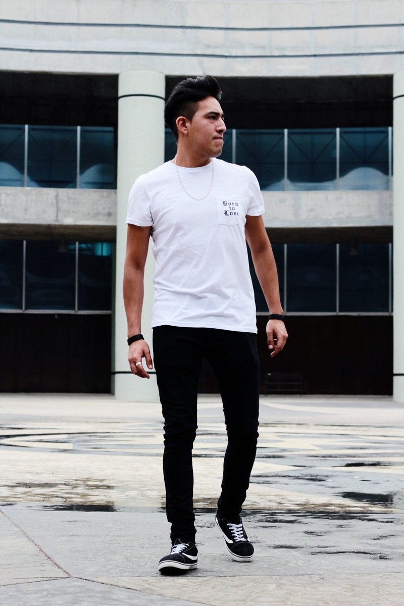 man, young adult, real people, pose, one person, close-up, photo session, front view, urban scene, outfit, building exterior, model, male, full length