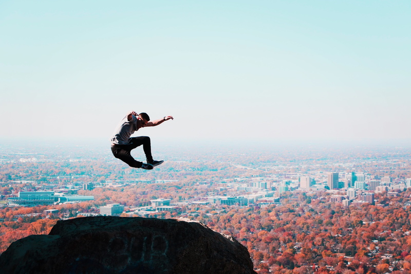 sky, cityscape, men, mid-air, trees, adult, nature, idahome, table rock, outdoors, leisure activity, rock, building exterior, boise, leaf, young adult
