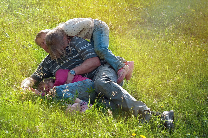 nature, relaxation, adult, children, full length, father, day, lying down, out, plant, play, human, outdoors, men, field, daughters, carrying, girl, males