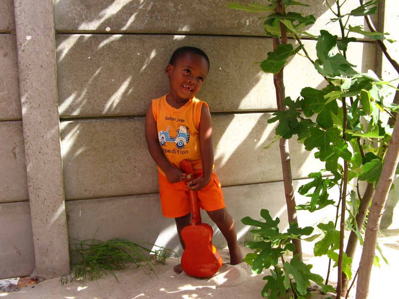 childhood, too much sweets, leaning, chapmans peak drive, innocence, shadow, child, africa, portrait, happy, light, orange color, bad teeth, childlike innocence