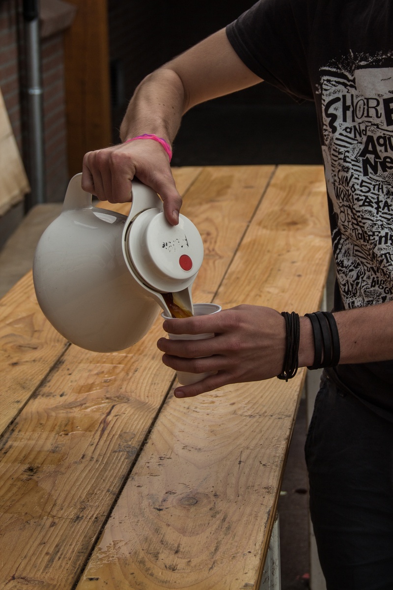 hand, food and drink, one person, coffee, wake up, 2K, cup, table, indoors, refreshment, wood - material, women, lifestyles, human body part, donate, tea cup