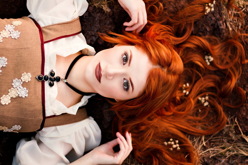 young adult, portrait, fashion, necklace, dress, looking at viewer, hair, looking at camera, headshot, real people, beauty, indoors, lying down, arms up