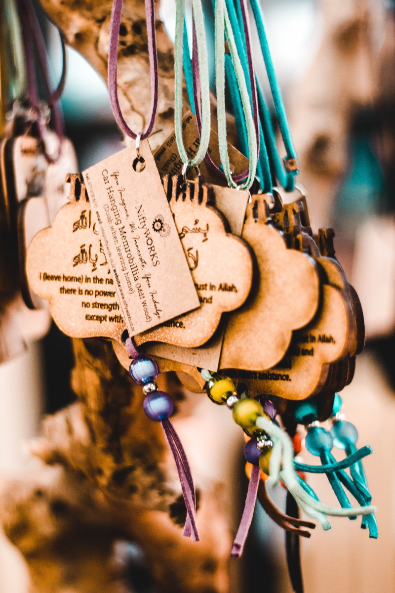 beads, western script, cable, souvenir, communication, focus on foreground, day, necklace, indoors, large group of objects, 5K, branch, emotion, message