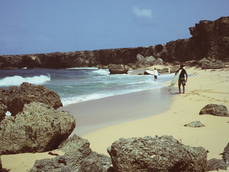 water, coastline, land, man, scenics - nature, surf, sea, beach, wave, walking, black, real people, tranquil scene, sand, holding, rock, beauty in nature