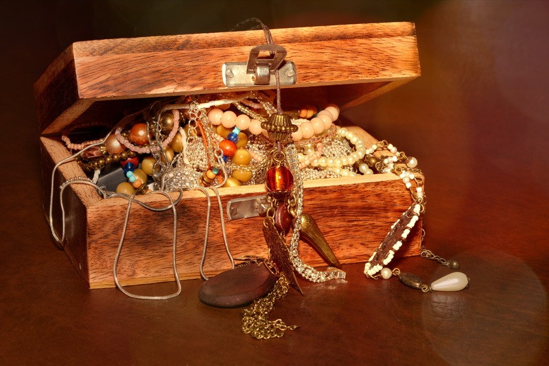 human representation, antique, jewellery, brown, open, art and craft, treasure chest, teddy bear, pearl jewelry, creativity, still life, bead, wooden, bracelets