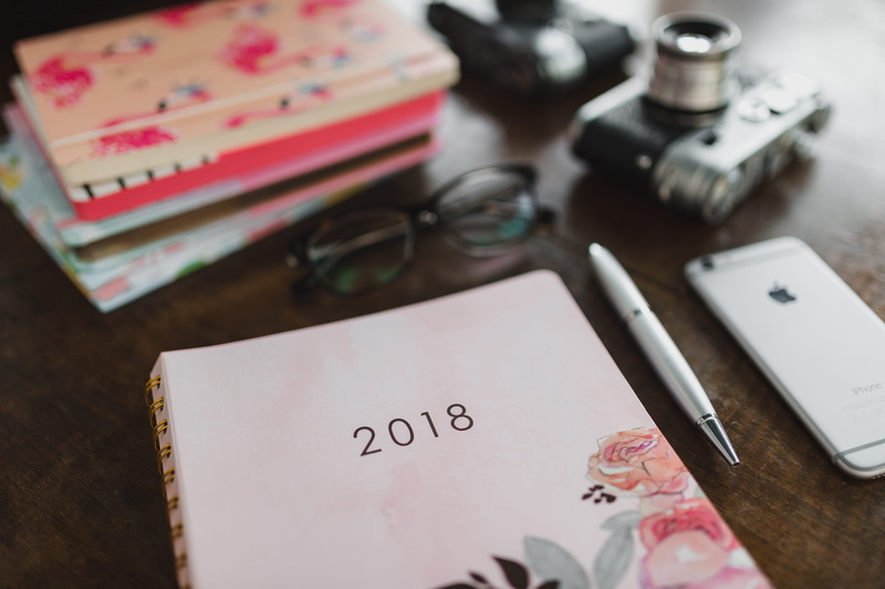 high angle view, communication, preparation, desk, scissors, note, note pad, table, writing instrument, pen, furniture, business, pink, notebook, selective focus