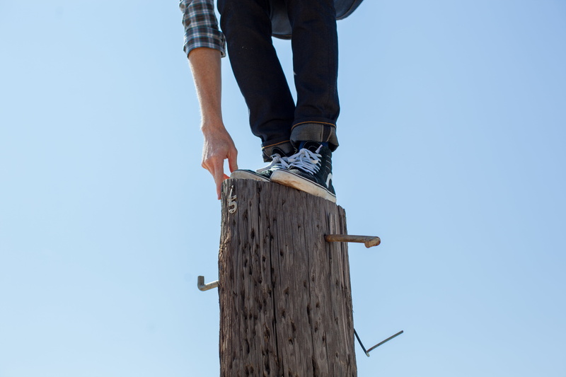low section, balance, low angle view, stub, casual clothing, body part, shoe, man, real people, sky, 5K, nature, balancing, standing, outdoors, copy space