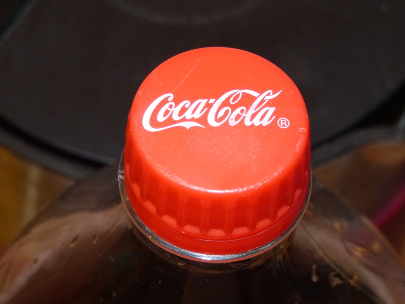 food and drink, bottle, coca cola, indoors, 4K, wood - material, business, western script, high angle view, cap, domestic room, communication, text, sign