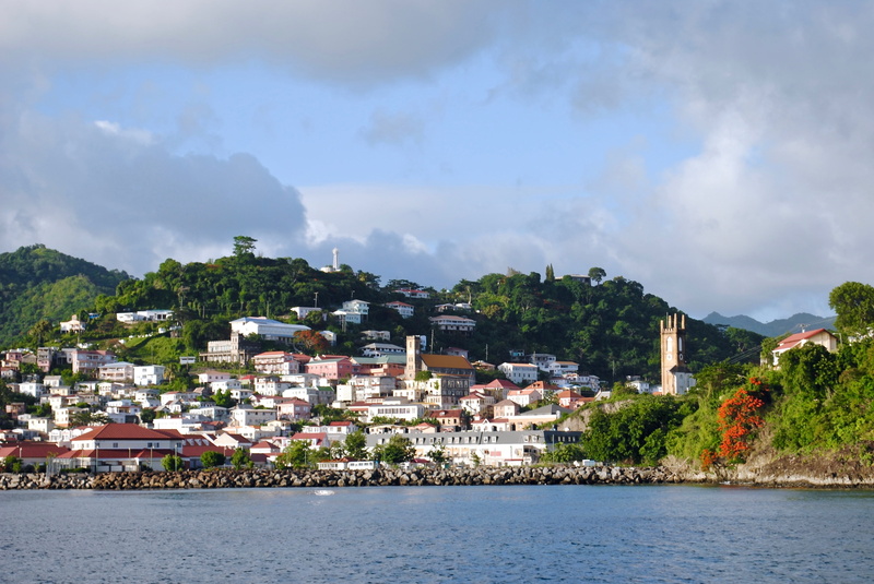 building exterior, tree, tourism, hill, architecture, mountain, city, ocean, seascape, caribbean, sea, shore, built structure, coast, getaway, waterfront