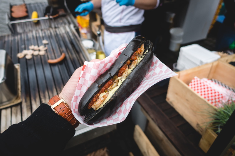5K, finger, sub, black, holding, human body part, take out food, street food, one person, hand, ready-to-eat, day, sandwich, hot dog, human hand, squid ink
