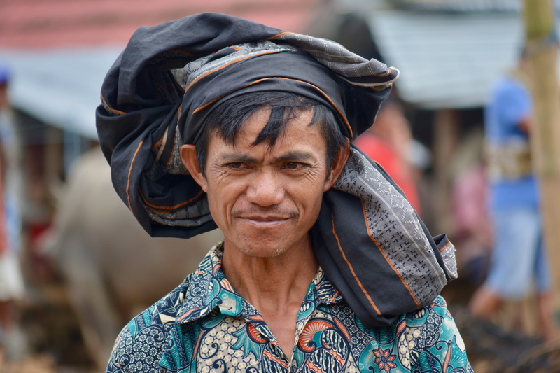 clothing, wrinkled, people, incidental people, day, traditional clothing, focus, women, looking at camera, social issues, adult, tattoo, outdoors, lifestyles