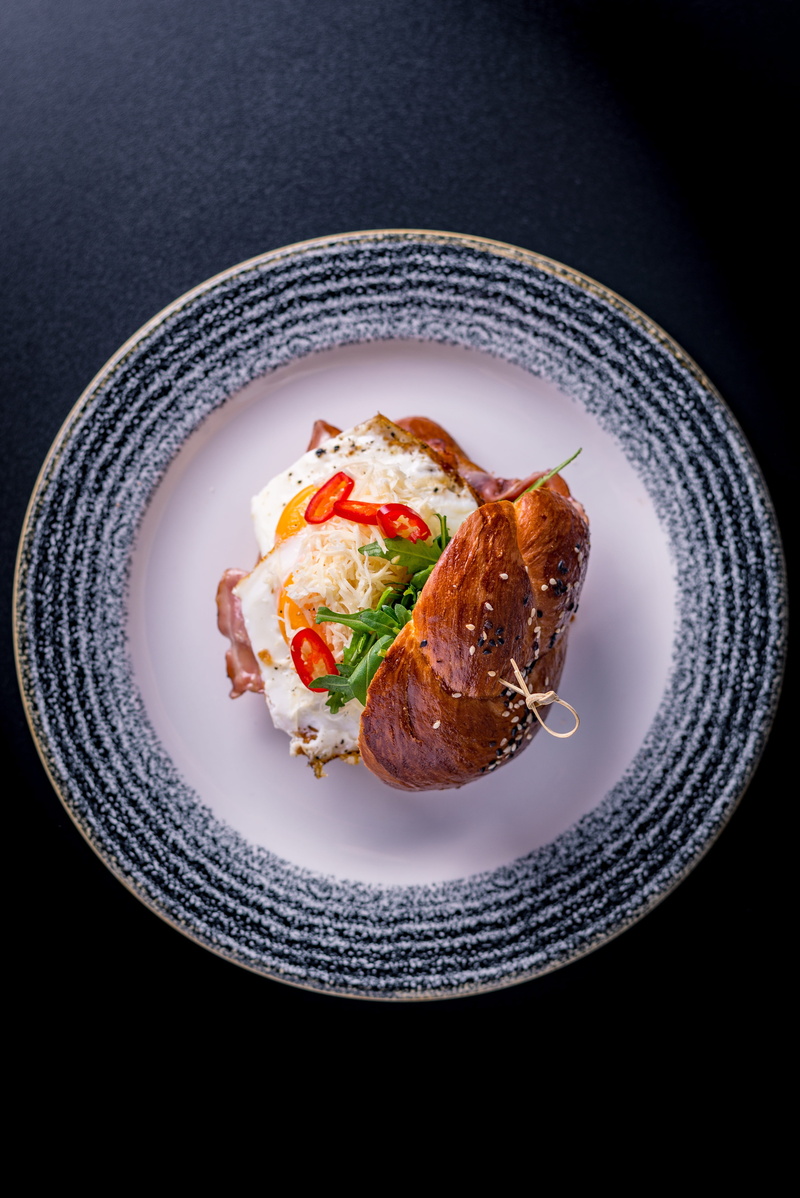 burger, high angle view, food and drink, eggs, breakfast, pictures of food, close-up, table, indoors, seafood, black background, temptation, bacon, vegetable