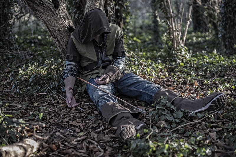 one person, sitting, student, leaf, casual clothing, green, self harm, woodland, still-life, shoe, environment, leisure activity, wood, clothing, full length