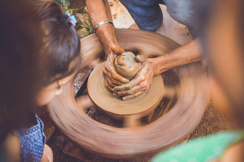craft, spinning, selective focus, preparation, art, mud, hand, experience, creativity, pottery, slow motion, women, high angle view, skill, girls, art and craft