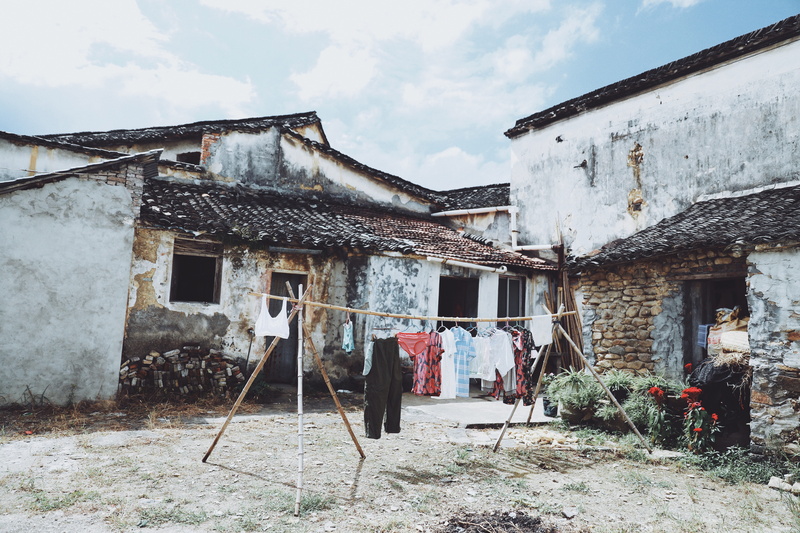 5K, countryside, houses, clothesline, laundry, sky, outdoors, hut, housing, damaged, rubble, hanging, building exterior, cloud - sky, day, grey, shelter