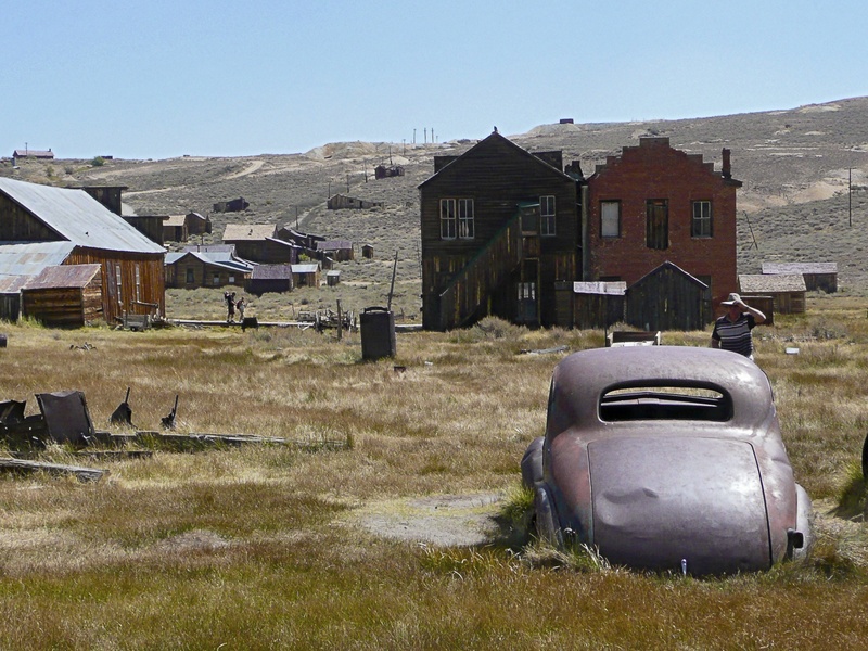 grass, country, transportation, tourist attraction, day, no people, mode of transportation, architecture, gray, house, old car, land vehicle, volkswagen
