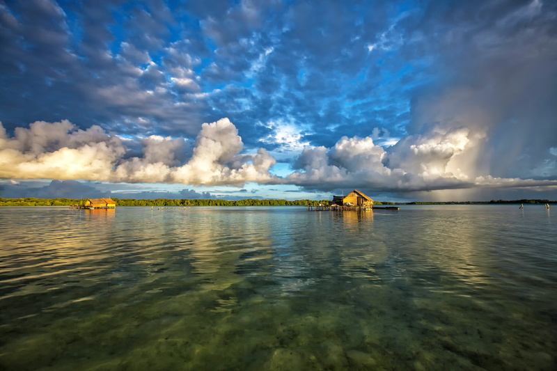 beauty in nature, blue, waterfront, no people, nautical vessel, sky, halmahera, cloud - sky, tranquility, sea, the water shed, nature, non-urban scene