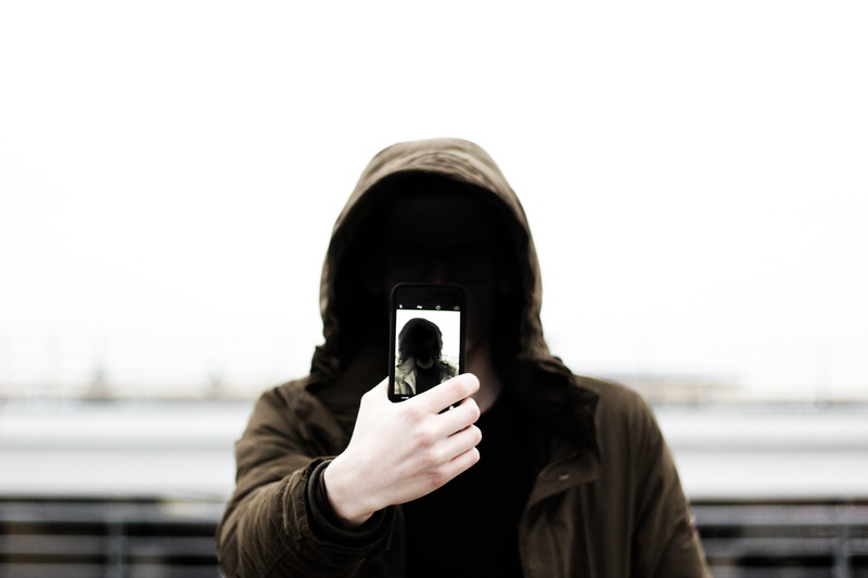 copy space, portrait, image, camera, hooded shirt, adult, headshot, standing, one person, obscured face, wearing, focus on foreground, hood - clothing