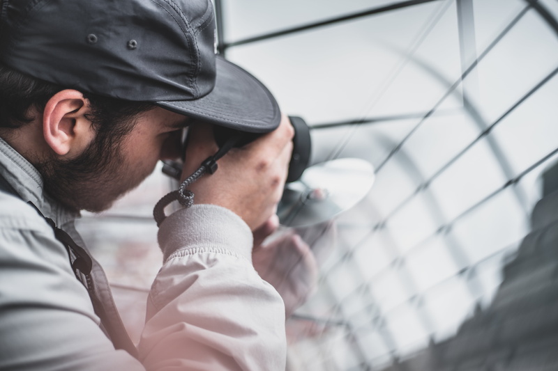 young adult, real people, man, young men, lifestyles, males, men, capture, using, security, people, photographer, blur, focus on foreground, businessman