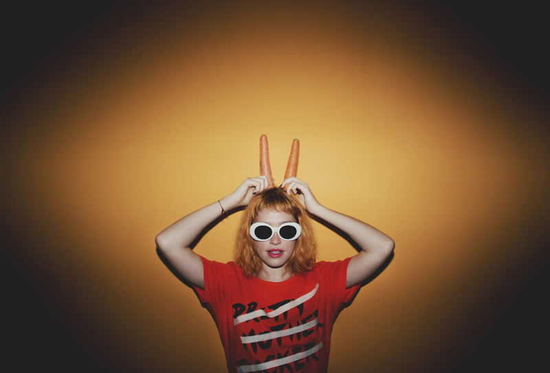 blonde, 1080P, standing, leisure activity, indoors, casual clothing, hairstyle, looking at camera, human arm, sunglasses, real people, portrait, red lipstick