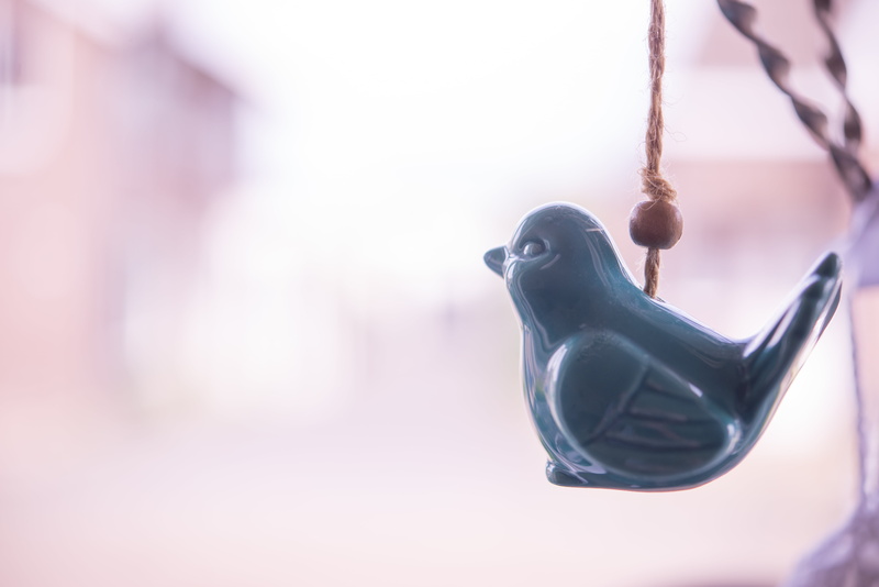 backgrounds, absence, ceramic, copy space, outdoors, bird, playground, simplicity, focus on foreground, blue, representation, selective focus, hanging