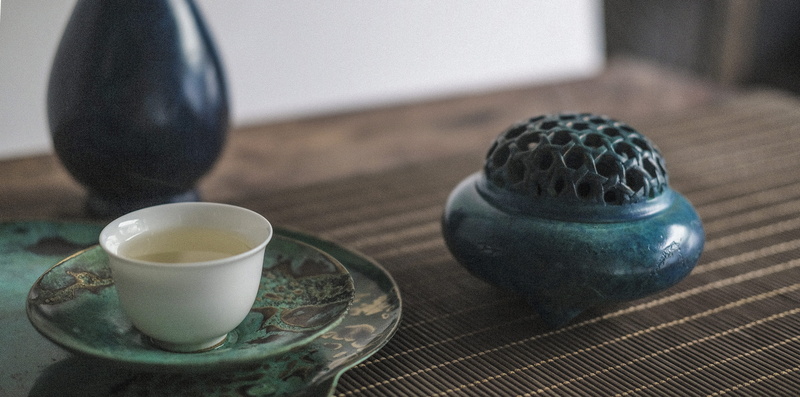 relaxation, food, indoors, art gallery, teapot, chinese culture, place setting, food and drink, hot drink, table setting, still life, artist, crockery
