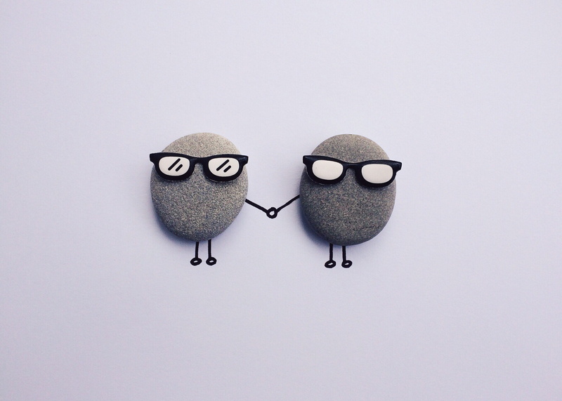 round, still life, representation, two objects, indoors, gray background, creative, animal, toy, foam, stuffed toy, gray, artsy, craft, no people, pebbles