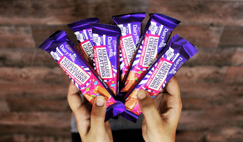 close-up, arts culture and entertainment, human body part, purple, hand, chocolate, multi colored, adult, cadburry, artsy, finger, 4K, holding, group of objects