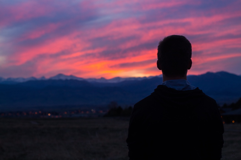 4k, focus on foreground, hd, 50mm, one person, standing, colorado sunset, leisure activity, waist up, afternoon, adult, 85mm, mountain range