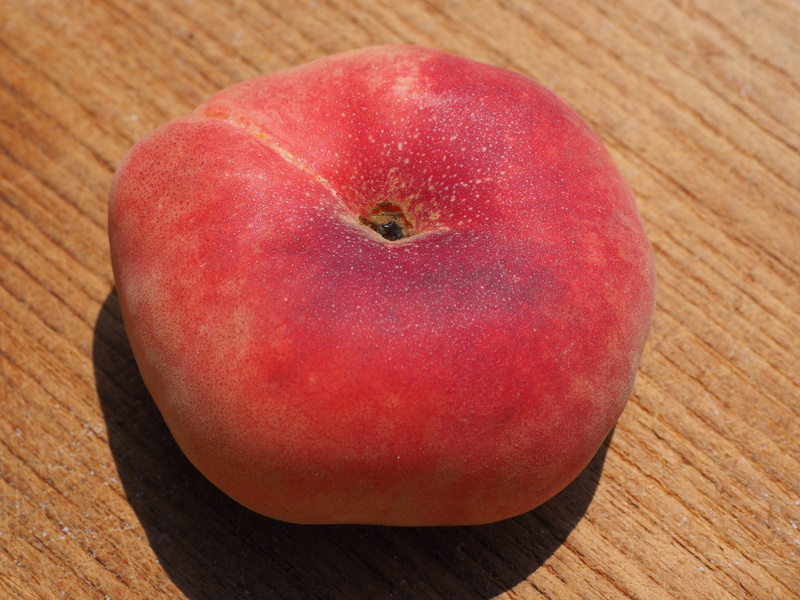ripe, food, vineyard peach, food and drink, no people, high angle view, nature, fruity, apple - fruit, single object, vitamins, wood - material, wood grain
