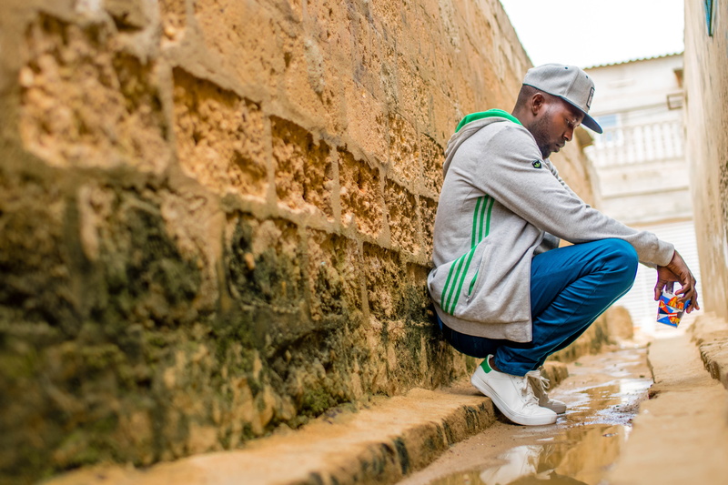 full length, men, fashion, day, side view, jeans, leisure activity, hat, near, adidas, man, cap, clothing, street, 5K, sitting, lifestyles, young men