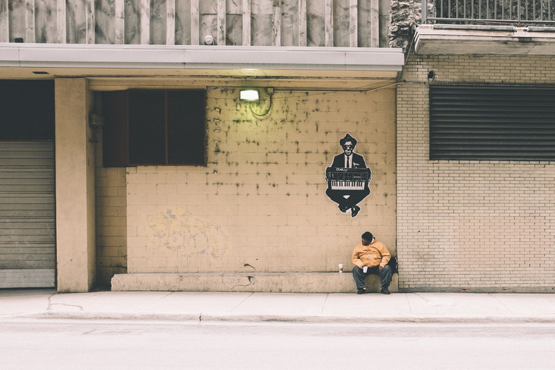 graffiti, road, painting, person, concrete, chicago, one person, shirt, sleeve, city, real people, street, white surface, walking, building exterior, playing