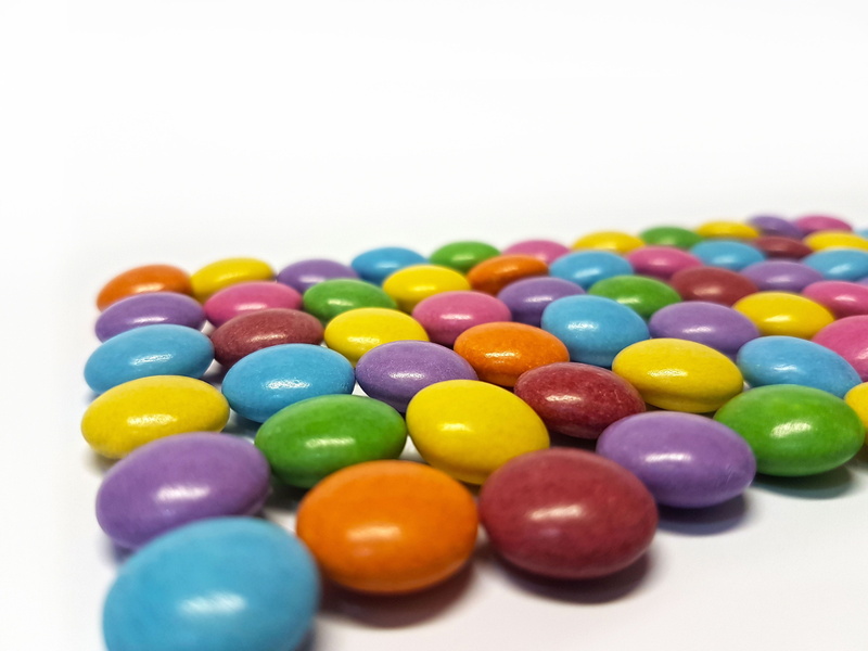 unhealthy eating, blue, studio shot, Smarties, choice, candy, yellow, Sweetness, sweet Food, colors, candies, no People, temptation, variation, food, food and drink