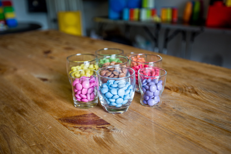 5K, choice, smarties, multi colored, pink color, table, food and drink, easter, purple, blue, focus on foreground, yellow, red, no people, wooden table