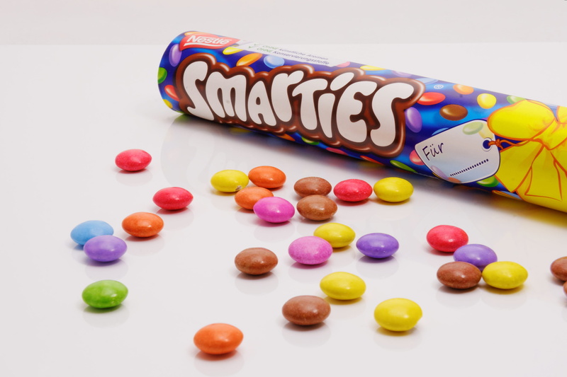 colorful, food and drink, smarties, baked, studio shot, text, 2K, white background, Nibble, still life, western script, indulgence, close-up, snack, Delicious