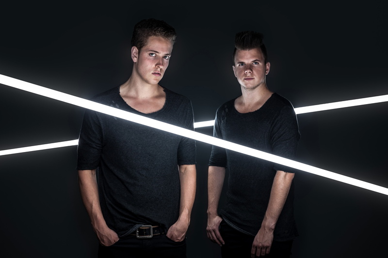 mid adult, people, young adult, casual clothing, standing, males, studio shot, young men, two people, adult, sick individuals, portrait, black background