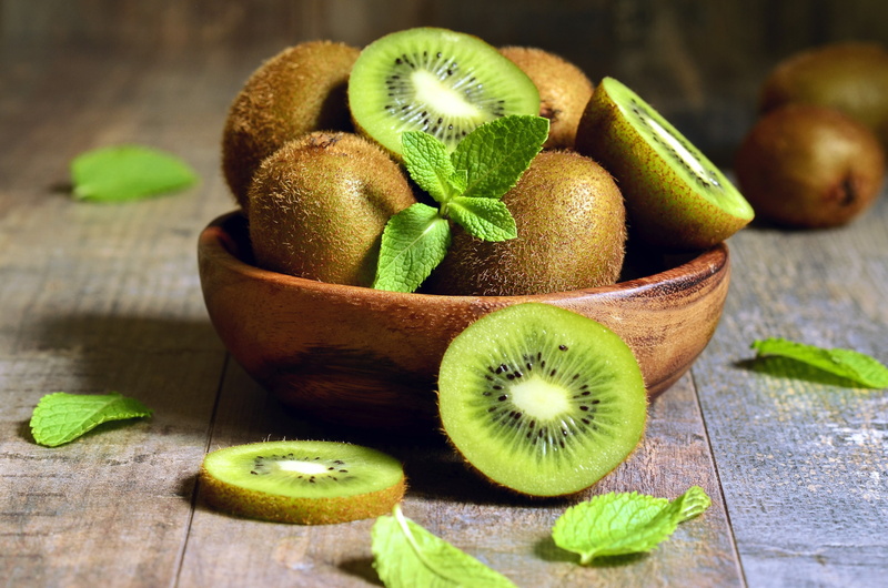 4K, fruit, halved, freshness, healthy eating, food, focus on foreground, still life, no people, wood - material, green color, studio shot, cross section
