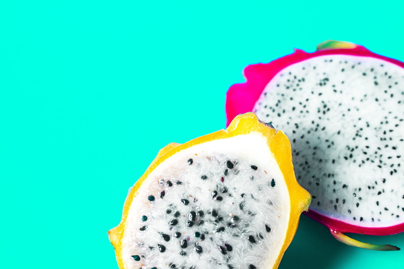pastries, indoors, no people, blue, halved, fruit, blue background, slice, cross section, freshness, food and drink, temptation, yellow, ripe, healthy eating